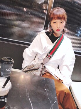 momoka桃華 is wearing UN3D. "サッシュショートシャツ"
