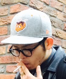 NEW ERA | なんか変なキャラが縫い付けてある。相方からのもらいもの。(キャップ)