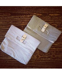 meagratia ストライプ柄別注クラッチバッグ（SAX/BLACK）(クラッチバッグ)