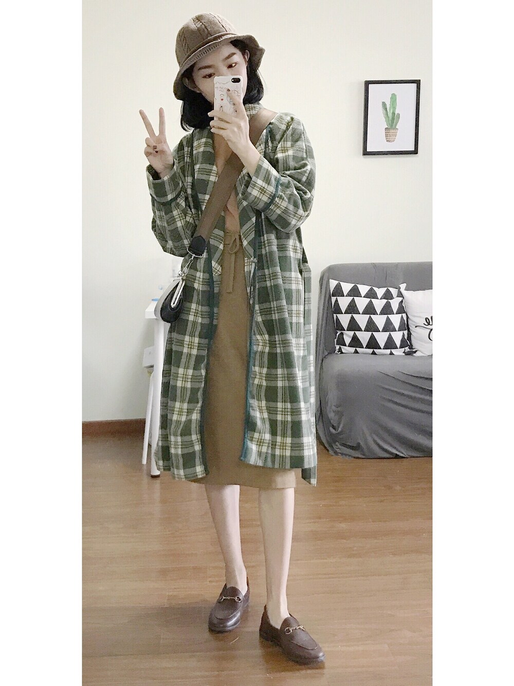 「P treeのアイテム（ダウンジャケット/コート、グリーン系）」を使った、陈石榴さん（レディース・167cm）の冬コーディネートの1枚目の写真