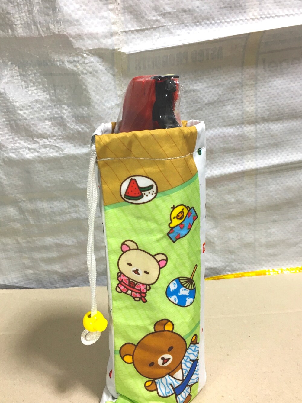 「リラックマ、ペットボトルカバー、おまけ、アースジェット」｜「リラックマのアイテム（ラッピングキット、グリーン系）」を使った、良いリプライさん（メンズ・50cm）の秋コーディネートの1枚目の写真