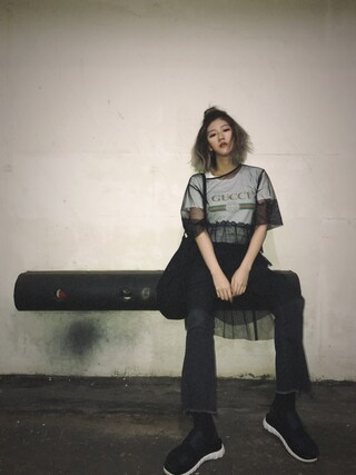 Lydia Liu  is wearing GUCCI "Gucci print cotton t-shirt"