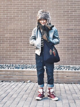 YOUKO CHIN is wearing Converse "Converse Chuck Taylor ® All Star ®   High Top Sneaker (Women)"