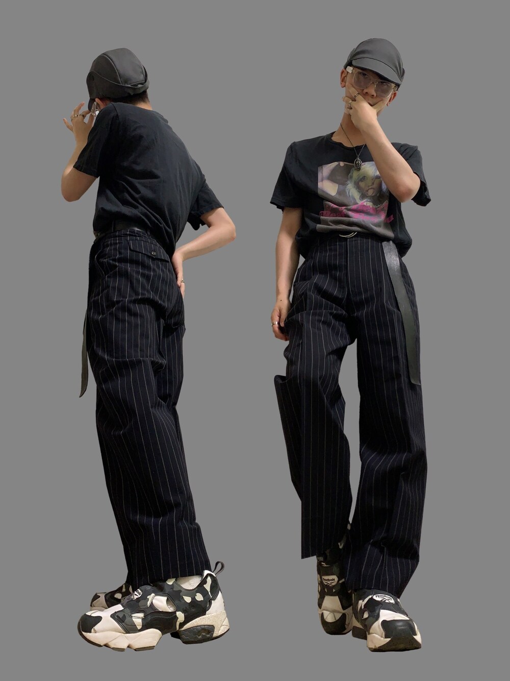 ブラック系のTシャツ/カットソー、ブラック系のスラックス、グレー系のスニーカーを着用したメンズの夏コーディネートの1枚目の写真