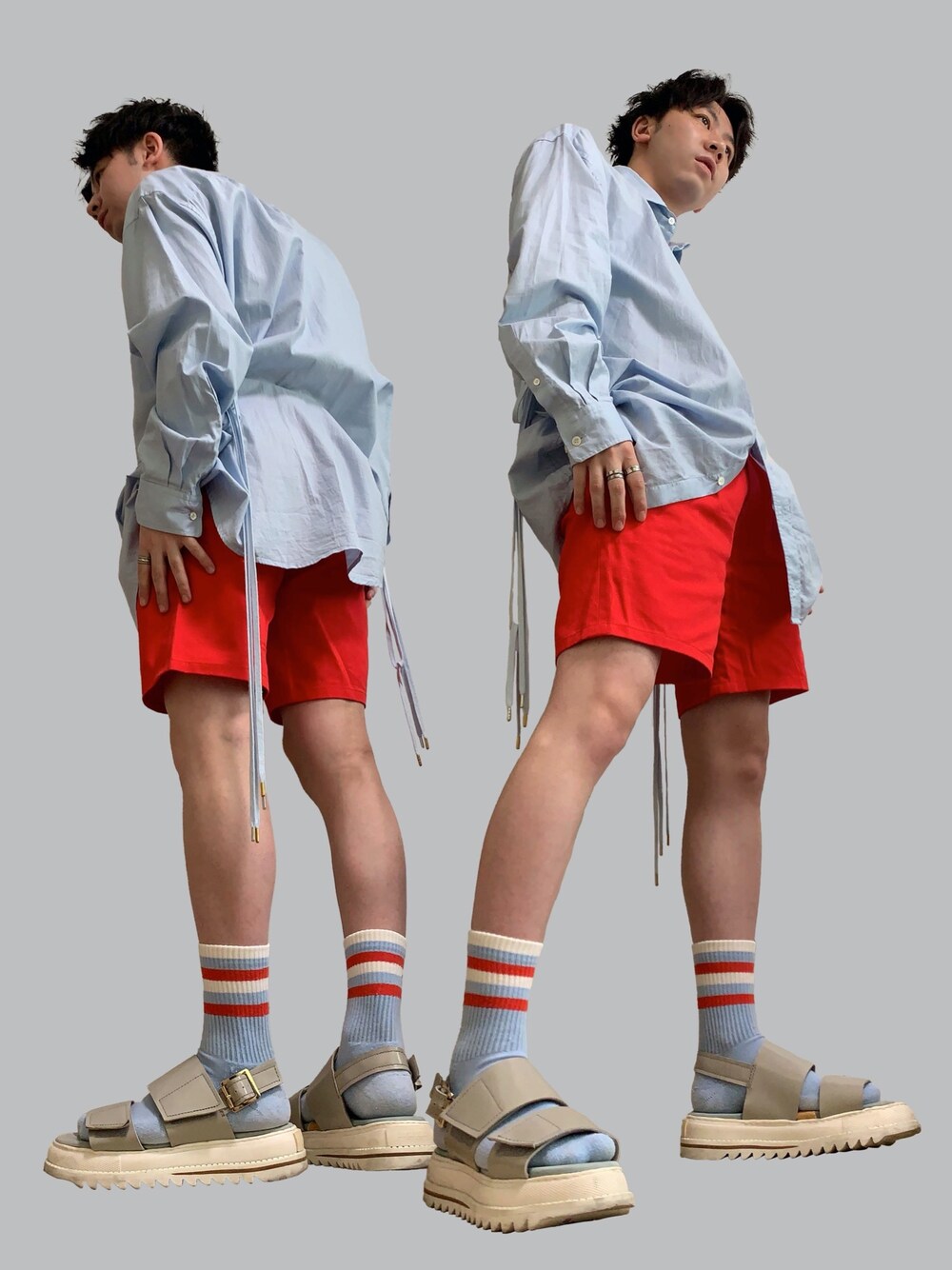 ブルー系のシャツ/ブラウス、レッド系のその他パンツ、ベージュ系のサンダルを着用したメンズの夏コーディネートの1枚目の写真