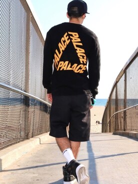 Toshi is wearing PALACE