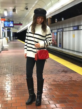 キャスケットを使った「ブーツインスタイル」のレディース