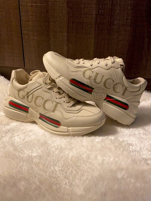 justin_w is wearing Gucci "Rhyton Gucci Print Leather Trainer"