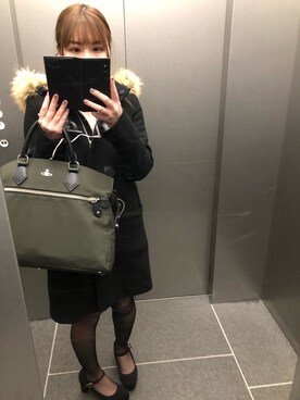 Vivienne Westwoodのビジネスバッグを使った人気ファッション