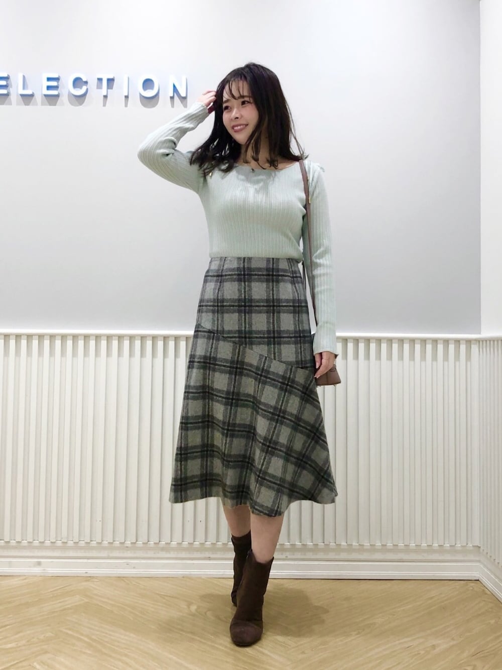 「ウィルセレクション、willselection、ミントグリーン、リブニット、チェック、チェックスカート、ショートブーツ、冬コーデ、ショルダーバッグ、ミント」｜「WILLSELECTIONのコンビストレッチブーツ（ブーツ、ブラウン系）」を使った、yuka.c5さん（レディース・159cm）の冬コーディネートの1枚目の写真