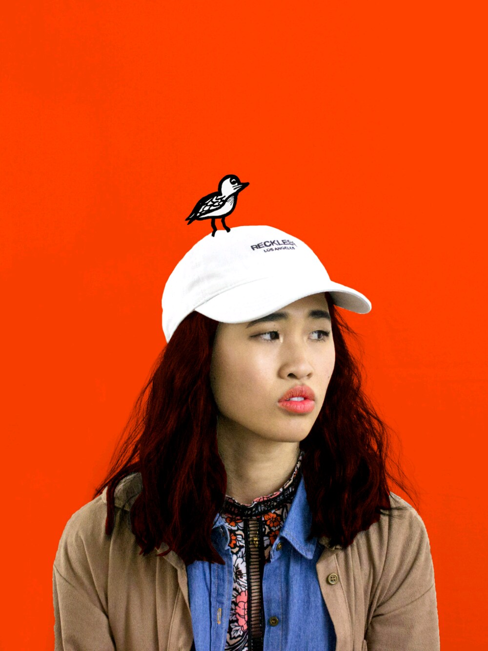 「denim、hat、casual、streetstyle、layering、jeans、floral、winter、orange、pattern」｜「asosのアイテム（その他アウター、ブラウン系）」を使った、Malinda Julie Ouchさん（レディース・168cm）の冬コーディネートの1枚目の写真