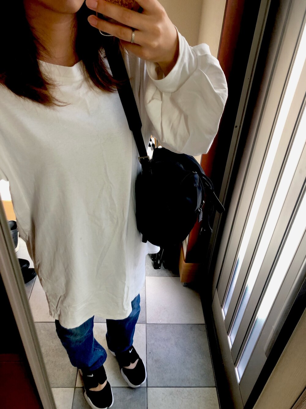 「PRADAのアイテム（バックパック/リュック、ブラック系）」を使った、yさん（レディース・157cm）の秋コーディネートの1枚目の写真