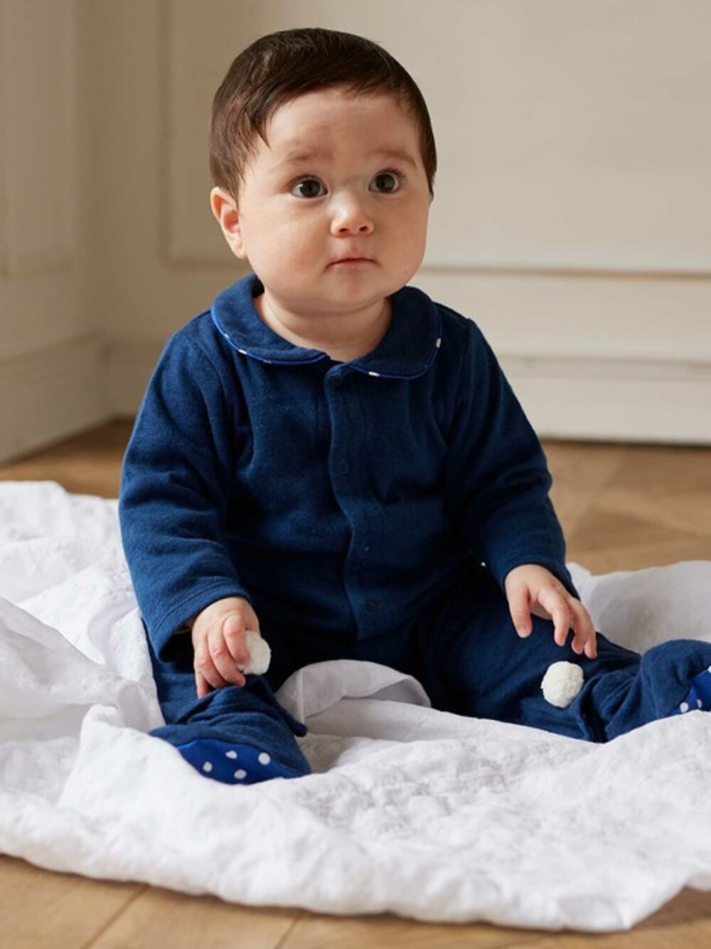 ブルー系のロンパースを着用したキッズの夏コーディネートの1枚目の写真