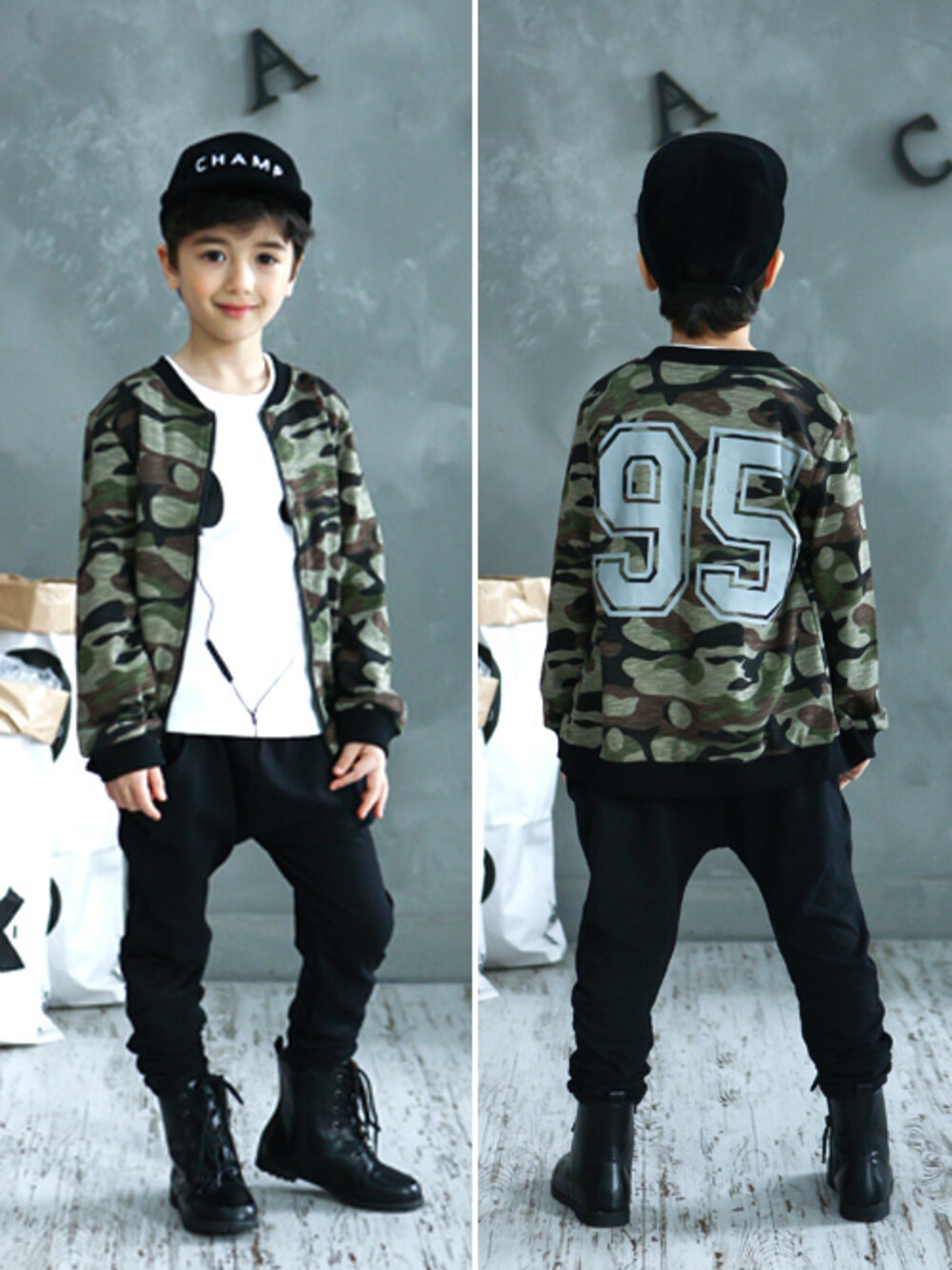 グリーン系のブルゾン、ブラック系のその他パンツ、ホワイト系のTシャツ/カットソーを着用したキッズの冬コーディネートの1枚目の写真