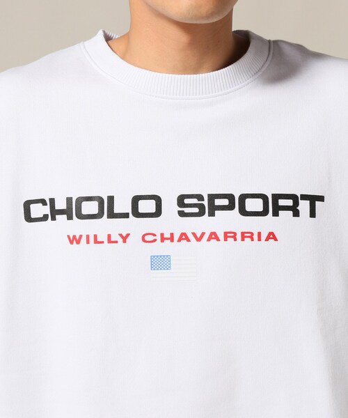 トップス WILLY CHAVARRIA WISM CHOLO SPORTS SWEAT WISM（ウィズム）の「WISM別注 WILLY CHAVAWISM CHOLO SPORTS