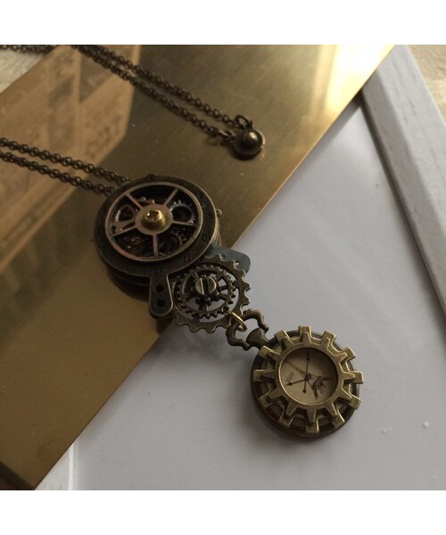 Handmade（ハンドメイド）の「歯車透ける二つの時計を繋ぐペンダント