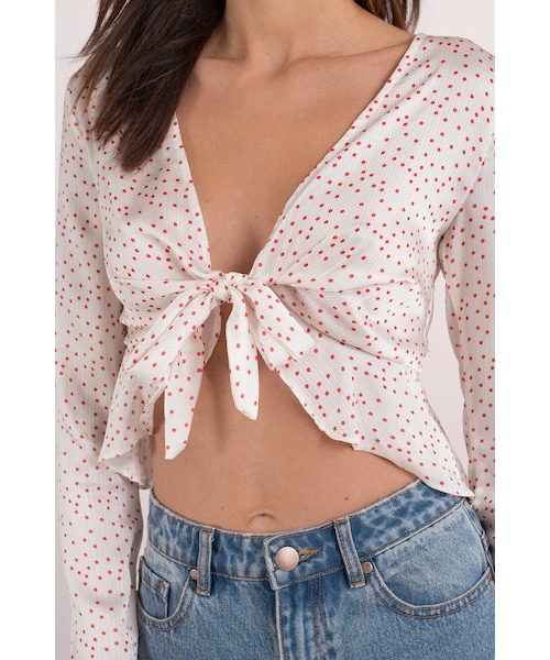 white and red polka dot blouse