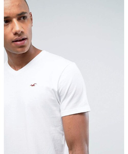 Hollister,Hollister V-Neck T-Shirt Slim Fit Icon Logo in White - WEAR