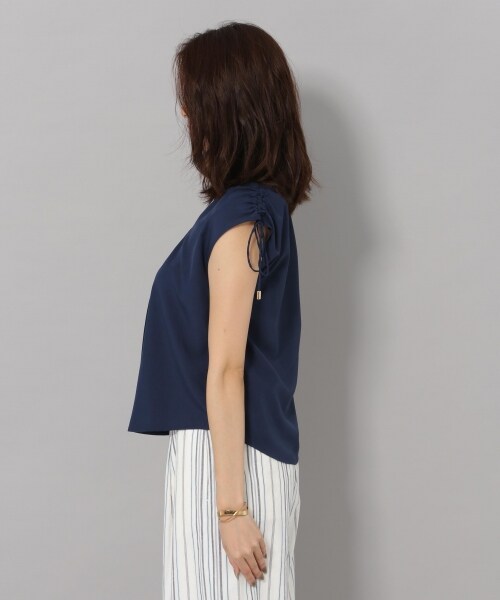 Andemiu(アンデミュウ)の「カタシャーリングブラウス(トップス・オフホワイト/オレンジ/ネイビー)」の8枚目の写真