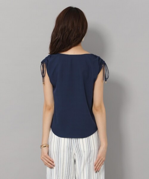 Andemiu(アンデミュウ)の「カタシャーリングブラウス(トップス・オフホワイト/オレンジ/ネイビー)」の9枚目の写真