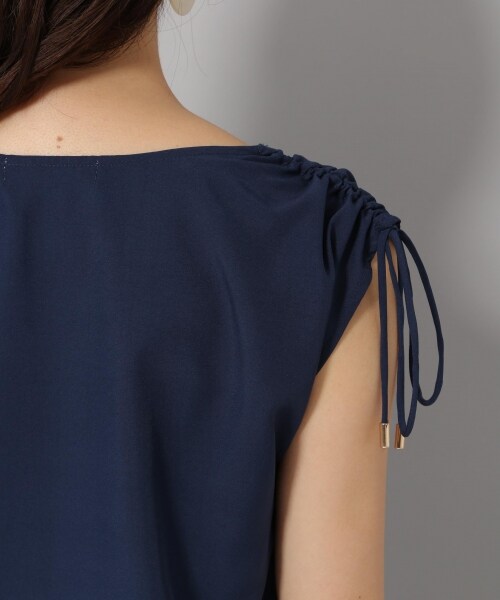 Andemiu(アンデミュウ)の「カタシャーリングブラウス(トップス・オフホワイト/オレンジ/ネイビー)」の10枚目の写真