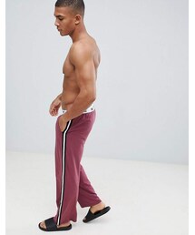 asos | ASOS DESIGN straight leg jersey pyjama bottom in burgundy with branded waistband(デニムパンツ)