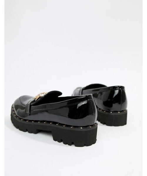 glamorous black chunky flat shoes with gold lion trim