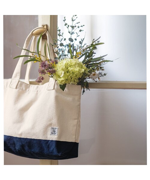 Sunny clouds(サニークラウズ)の「サニークラウズ マリンなキャンバスバッグ(バッグ・財布・靴 > バッグ > その他バッグ・レディース・ホワイト/ネイビー)」の1枚目の写真