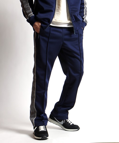 Needles(ニードルス)の「別注Papillon Emb Side Line Track Pant(パンツ・メンズ・ネイビー/パープル・S/M)」の1枚目の写真