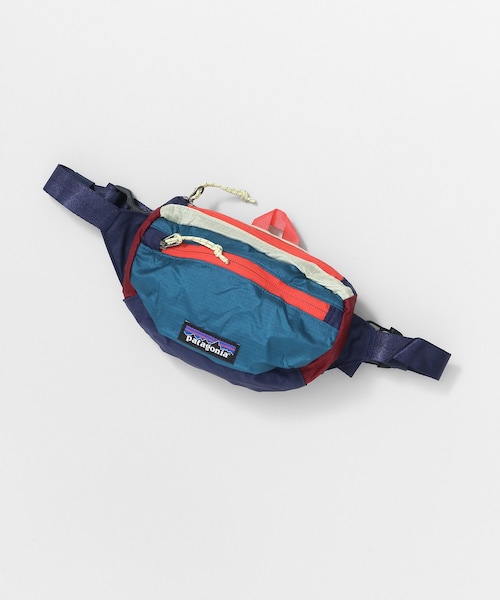 patagonia(パタゴニア)の「patagonia Travel Mini Hip pack(バッグ・レディース・BLK/CNMO/TTPS/REYE/PARC・one)」の1枚目の写真
