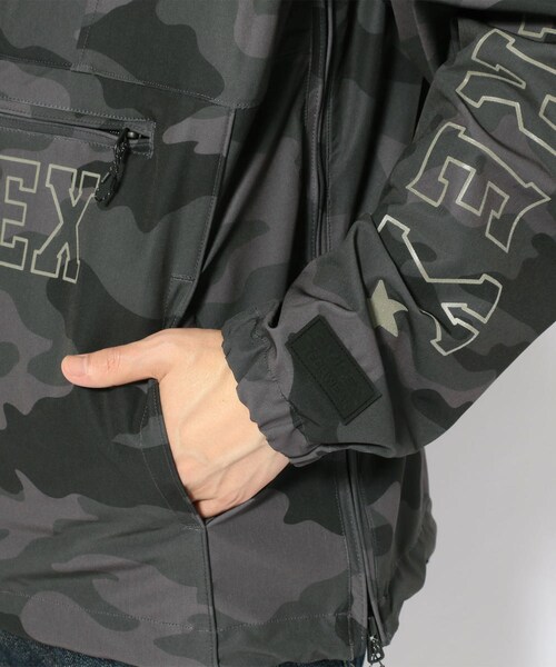 AVIREX（アヴィレックス）の「リフレクティブ ロゴ ストレッチ アノラック/REFLECTIVE LOGO STRETCH ANORAK（ジャケット/アウター・メンズ・WHITE/BLUE/GREY/CAMO・M, L, XL, XXL）」の7枚目の写真