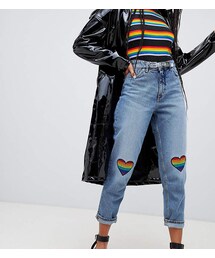 Monki Taiki high waist mom jeans with organic cotton and raindow detail in mid blue