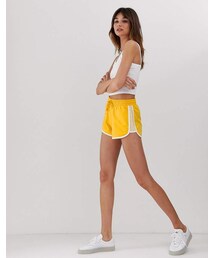 Monki shorts with drawstring and panel detail in yellow