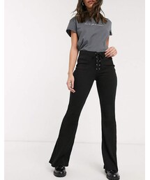 Bershka ribbed flared pants with tie up detail in black