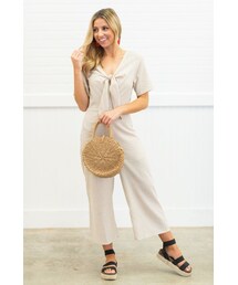 The Mint Julep Boutique Chic Concepts Taupe and White Striped Jumpsuit