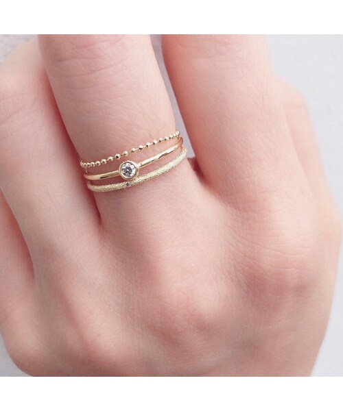 pinacoteca（ピナコテーカ）の「ピナコテーカ 652 フローティング 一粒ダイヤモンド フローラル クロス リング ピンキーリング 0.05ct（リング・レディース・ゴールド・マイナス5号から13号）」の2枚目の写真