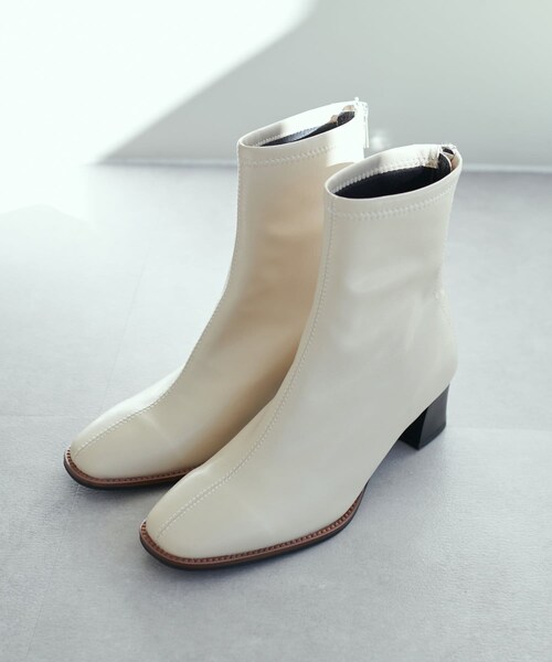 DISCOAT(ディスコート)の「スタックヒールストレッチブーツ(ブーティ・レディース・ブラック/アイボリー・M/L)」の1枚目の写真