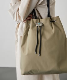 ear PAPILLONNER（イアパピヨネ）の「コンチョ巾着バッグ Lサイズ