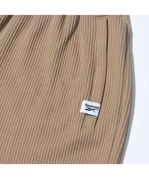 Reebok（リーボック）の「ジムワッグ サイドスリット ニットパンツ