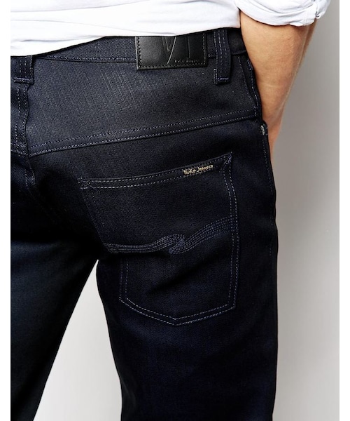 Nudie Jeans（ヌーディージーンズ）の「Nudie Jeans Thin Finn Slim Fit Dry Navy Cristal Coated（デニムパンツ・メンズ・blue・W34 L34-W34in (86cm)L34in (86cm)/W28 L32-W28in (71cm)L32in (81cm)/W31 L32-W31in (78cm)L32in (81cm)/W33 L32-W33in (83cm)L32in (81cm)/W32 L32-W32in (81cm)L32in (81cm)/W38 L32-W38in (96cm)L32in (81cm)/W30 L32-W30in (76cm)L32in (81cm)/W31 L30-W31in (78cm)L30in (76cm)/W36 L32-W36in (91cm)L32in (81cm)/W32 L34-W32in (81cm)L34in (86cm)/W34 L30-W34in (86cm)L30in (76cm)/W33 L30-W33in (83cm)L30in (76cm)/W34 L36-W86cm L91cm/W32 L30-W32in (81cm)L30in (76cm)/W30 L30-W30in (76cm)L30in (76cm)/W30 L34-W30in (76cm)L34in (86cm)/W34 L32-W34in (86cm)L32in (81cm)）」の2枚目の写真